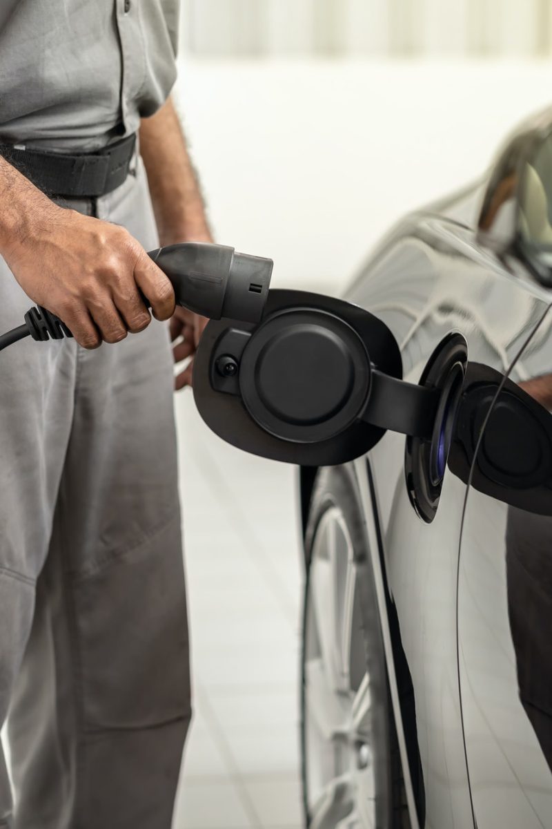 closeup-asian-technician-hand-is-charging-the-electric-car-or-ev-in-service-center.jpg